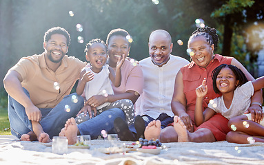 Image showing Portrait, happy black family and picnic in summer happiness and bubbles in nature fun and bonding time. Joyful African people smile together in group generations and moments relaxing in the outdoors