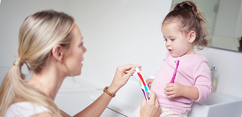 Image showing Baby kid brushing teeth with mom in bathroom, morning oral hygiene and clean dental healthcare wellness. Parent with toothpaste and toothbrush teaching young toddler girl child healthy mouth cleaning