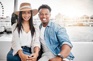 Image showing Couple, love and yacht with a man and woman on a date on the sea or ocean with the city, harbor or promenade in the background. Dating, romance and affection with a diverse male and woman outdoor