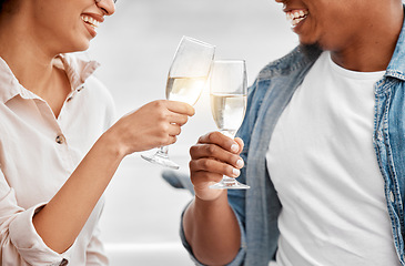 Image showing Celebrate, toast and couple with champagne for anniversary, date or luxury travel vacation together. Love, cheers and happy hands of man and woman holding glass of wine for joy, drink and event