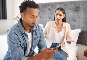 Image showing Couple or black man ignore frustrated woman with phone on social media, online or internet sitting on bed. Young black people dating, angry and upset risk divorce from cheating infidelity mistake