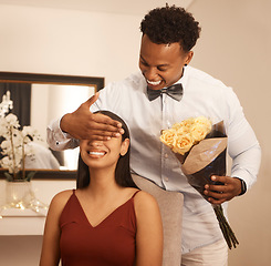 Image showing Love, couple and flowers with a man and woman on a surprise date for their anniversary or celebration event. Young male with his hand on the eyes of a female while dating for romance and affection