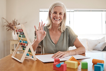 Image showing Home teacher in video call teaching elearning education, knowledge and math development training with notebook and hello. Senior woman in a zoom call class or online assessment with POV portrait