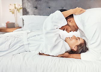 Image showing Couple holiday, hotel bedroom and happy on luxury vacation for wedding celebration, smile for love on bed and happiness hug together in house. Man and woman relax with romance in house apartment