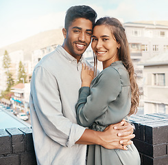 Image showing Love, couple and travel with a man and woman tourist hugging on a balcony in a foreign city together. Romance, dating and diversity with a young male and female on honeymoon overseas or abroad