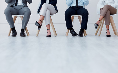 Image showing Business people waiting at recruitment company for a job interview or hiring meeting. Closeup of a group of employees sitting on chairs in a waiting room or office to join a corporate team project.