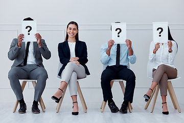 Image showing Job interview, question mark and feedback with business people sitting with sign for review, recruitment and search. Why, faq and hiring with employees holding icon for opinion, vote or policy