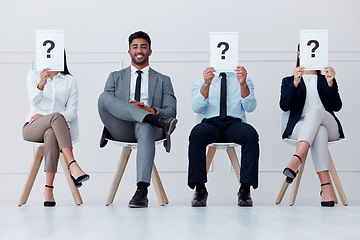 Image showing Man at recruitment company and question with smile, job interview or hiring with manager or boss to join team of workers. Happy male in group with people for job at business or office for work growth