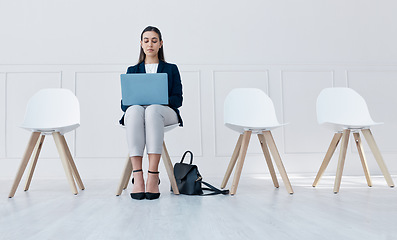 Image showing Recruitment, laptop and woman in waiting room for we are hiring or Human Resources online post while sitting on chair in office. Shortlisted person at corporate interview for job opportunity in HR