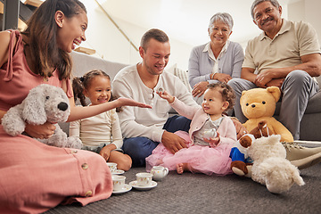 Image showing Big family portrait in kids room with tea party toys for play and bonding together on the floor. Happy grandparents, mother and father with baby in their family home having fun sitting on the ground