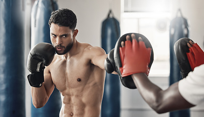 Image showing Boxing pad, sports man and gym exercise coaching with personal trainer expert for tournament. Strong, muscular and tough mma athlete doing fitness practice for wellbeing and punch discipline.