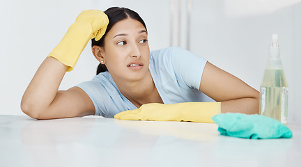 Image showing Stress, annoyed or bored woman with cleaning, housekeeping product and liquid spray bottle. Maid anxiety, frustrated worker and burnout home cleaner service with fabric for interior room spring clean