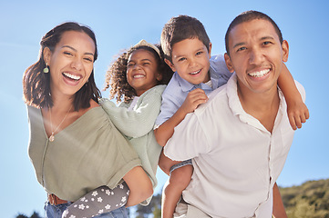 Image showing Happy family portrait, parents piggyback children and smile together at outdoor park in blue sky with father. Young mother with cute kids, fun sunshine happiness and beautiful summer brazil holiday