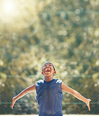 Image showing Happy, excited and shouting basketball child with a smile outdoor on sport court. Black boy playing, enjoy and fitness while training, exercise or practice during summer at sports club with happiness