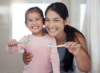 Image showing Portrait of mom and kid brushing teeth, dental healthy and cleaning in bathroom at home. Happy mother and girl learning oral healthcare, wellness and fresh breath for toothbrush, toothpaste and smile