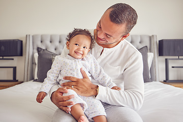 Image showing Happy baby and father relax in a bedroom portrait for love, support and child care. Excited, happiness of dad holding newborn girl, child or kid bonding together for healthy growth development