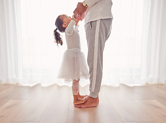 Image showing Family, dance and daughter on dad feet together on floor of interior for happiness, childhood and bonding. Care, love and youth with father dancing with child, walking on foot step for support