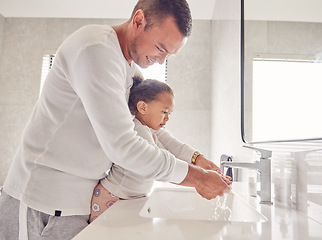 Image showing Children, cleaning and family with a man and girl washing their hands in the bathroom at home together. Kids, water and hygiene with a father teaching his daughter about clean and healthy living