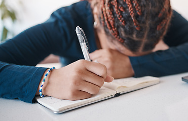 Image showing Hand, writing and notebook with an author or writing suffering from stress, anxiety or burnout in her office. Mental, writers block and fatigue with a female journalist or publisher at work