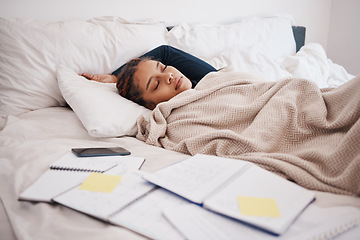 Image showing Tired, burnout and sleeping scholarship student in bed after study or research with books. Woman sleep, rest or fatigue while studying or learning for test or exam with notebook in bedroom