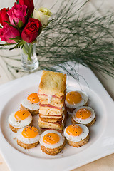 Image showing A Starter Of Mini Fried Quail Eggs And Sweet Back Bacon Sandwich