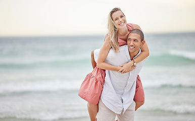 Image showing Travel, beach and woman on man back enjoying bonding for romance, love and relationship together. Summer, holiday and happiness with piggy back couple by the sea on a vacation trip for fun and joy