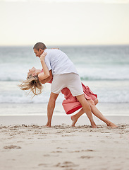 Image showing Dancing, happy couple and beach celebrate of love, trust and engagement on romantic luxury holiday travel Bali vacation. Man and woman or dancer couple celebration on sea water, sand and sunset ocean