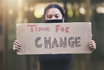 Image showing Woman, protest and sign for change in human rights, gender based violence or equality against a bokeh background. Female activist protesting holding billboard message to voice community improvement