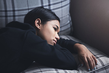 Image showing Depression, mental health and woman thinking about a sad memory feeling upset and grief after suffering a loss. Stressed, depressed and disappointed girl worried about a personal problem on the sofa