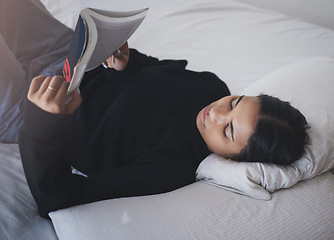 Image showing Woman, student and reading book in bedroom for relax, learning and studying at home. Young teenager, college girl and person rest with books in bed for education, knowledge and fiction novel story