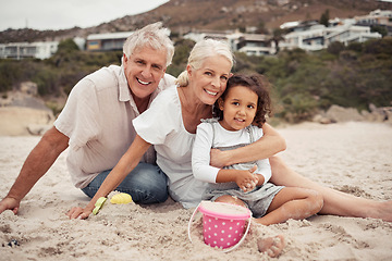 Image showing Beach, family and love with a girl and her grandparents on the beach together for fun, bonding and holiday. Travel, vacation and smile with a happy senior couple and their granddaughter on the sand