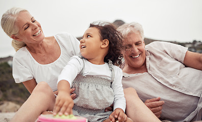 Image showing Family, love and beach fun with kid and grandparents enjoying the sand, free time and bonding on summer holiday. Senior woman and man enjoying travel and playing with girl grandchild on a vacation