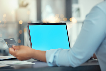 Image showing Hands, business woman with a credit card and laptop with blue screen in modern office. Employee paying personal house mortgage, debt bills or ecommerce shopping with online banking on computer.