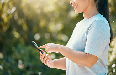 Image showing Woman, phone and nature park while touching screen for mobile app, communication for sustainability and environment management tool. Hand of female with 5g network and technology connection outside