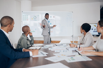 Image showing Business, meeting and businessman speaker talking about company data, graph and analytics. Diversity employee group with corporate manager working on a teamwork strategy presentation in a office