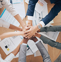 Image showing Team hands, collaboration and meeting of business people in agreement together above papers at work in the office. Group of employee hand in teamwork, agree and pile for company goal strategy or plan