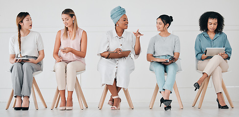Image showing Hiring, recruitment and interview of business women waiting for company management hire team. Diversity of talking and work communication of group using technology in a office to wait for a meeting
