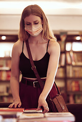 Image showing Covid, face mask and woman with books in a library, bookshop or educational building for knowledge, reading or research. Young female student browsing and choosing novel on table in a bookstore