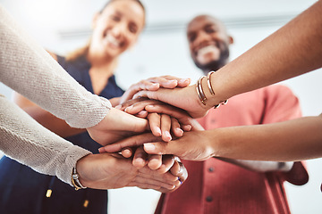 Image showing Hand, teamwork and motivation with a business team and their hands in a huddle while standing in a circle in the office together. Collaboration, goal and success with a group of staff in celebration