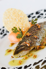 Image showing Sea Bass fillet and pine nut oil