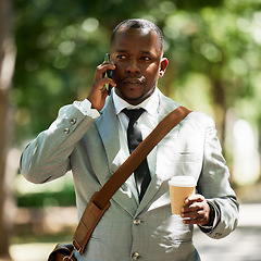 Image showing African businessman in street, has phone call with coffee or tea in cup. Corporate black man has work conversation on cellphone, walking to take break in lunch time in town or city