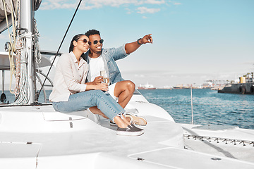 Image showing Couple, love and yacht with a man and woman out at sea or on the ocean for romance and a luxury date or cruise. Happy, trust and care with a young male and female on a boat in the water together