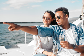 Image showing Boat, yacht and couple with champagne in the summer sun and sea to celebrate love together. Happy smile of people by ocean water, blue waves and sunshine in nature for a anniversary celebration