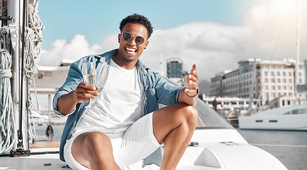 Image showing Champagne drink, yacht vacation and man on holiday in Miami, happy on a boat in the sun and international summer. Portrait of African person smile, excited and relax on luxury deck in the sunshine