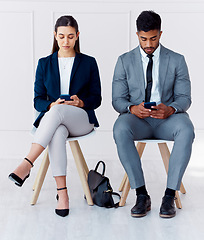 Image showing Hiring, interview and phone of businessman and woman with diversity in a office waiting room. Corporate potential workers wait for a company human resources meeting with technology and 5g internet
