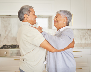 Image showing Love, happy and elderly couple dance in a kitchen at home, bonding and having fun. Mature man and woman hug, being playful and loving, enjoying their relationship and retirement together indoors