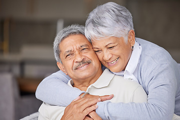 Image showing Living room, love and senior couple hug on sofa for romantic embrace while they relax together in home. Care, trust and happiness in married relationship with partner in sweet marriage and commitment