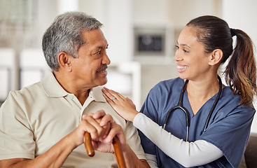 Image showing Nurse or caregiver with elderly man patient helping support, trust and care on sofa at retirement nursing home. Happy consulting healthcare doctor give helping hand to Alzheimer medical senior male