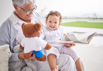Image showing Story, book and baby with grandmother and teddy bear for child development, learning and growth with happy smile portrait. Grandma reading to kid on the patio at their family home for love and care