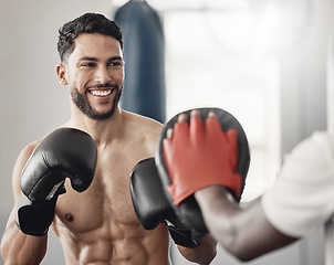 Image showing Fitness boxing, happy man training workout and cardio exercise motivation goals. Healthy muay thai athlete, strong ab muscle power and young sports mma boxer smile in gym with boxing gloves